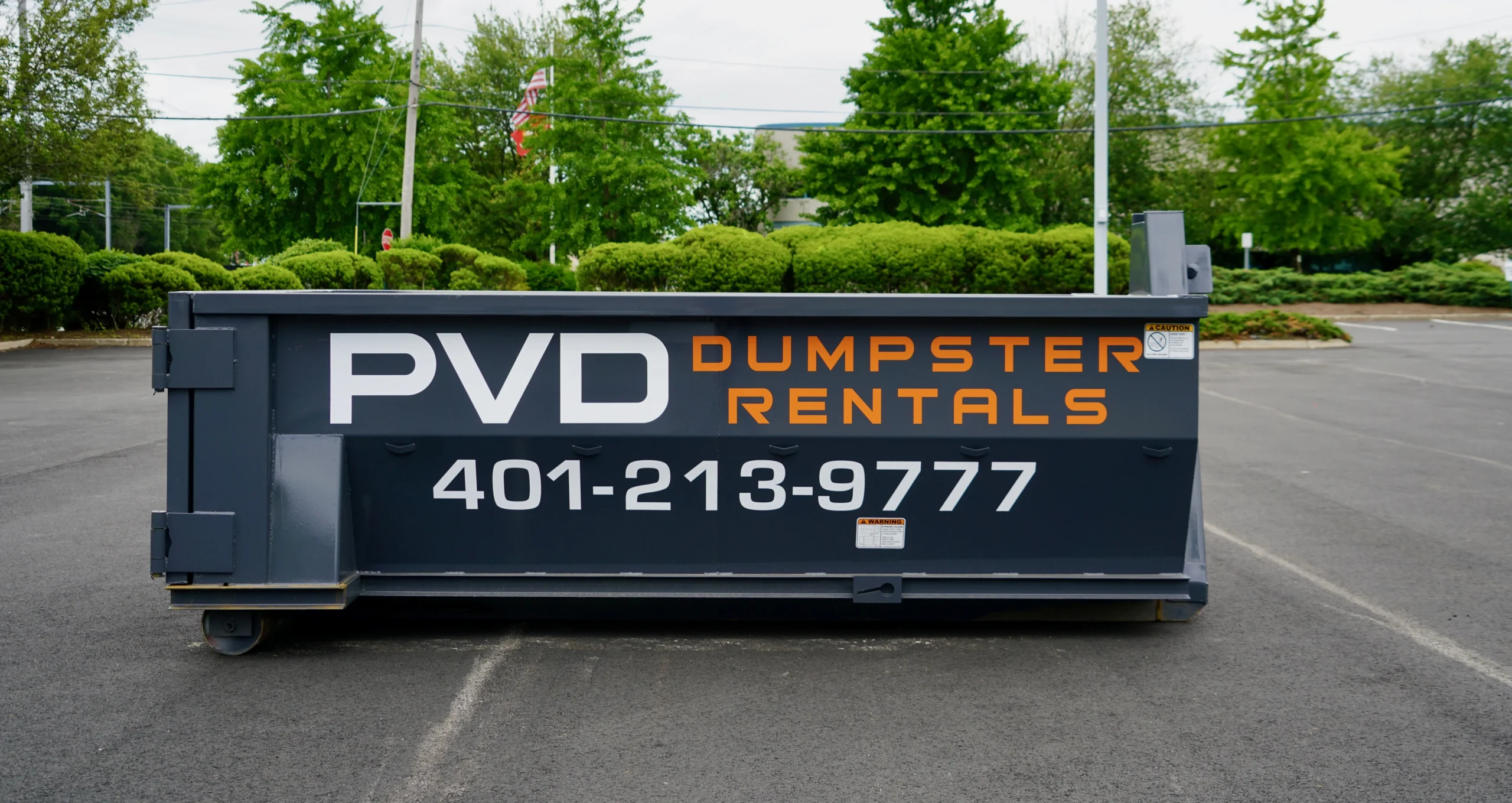 Empty 10 yard roll-off dumpster ready for delivery in Cranston
