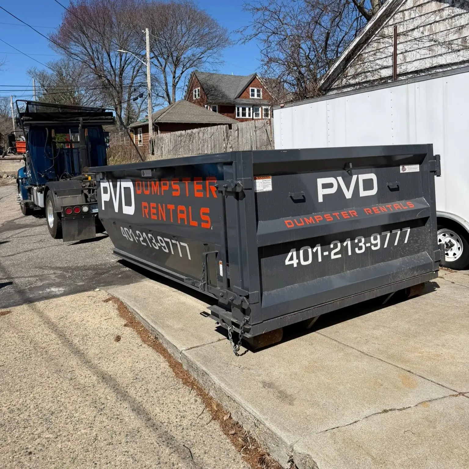15 yard roll-off dumpster dropped at the curb in Cranston