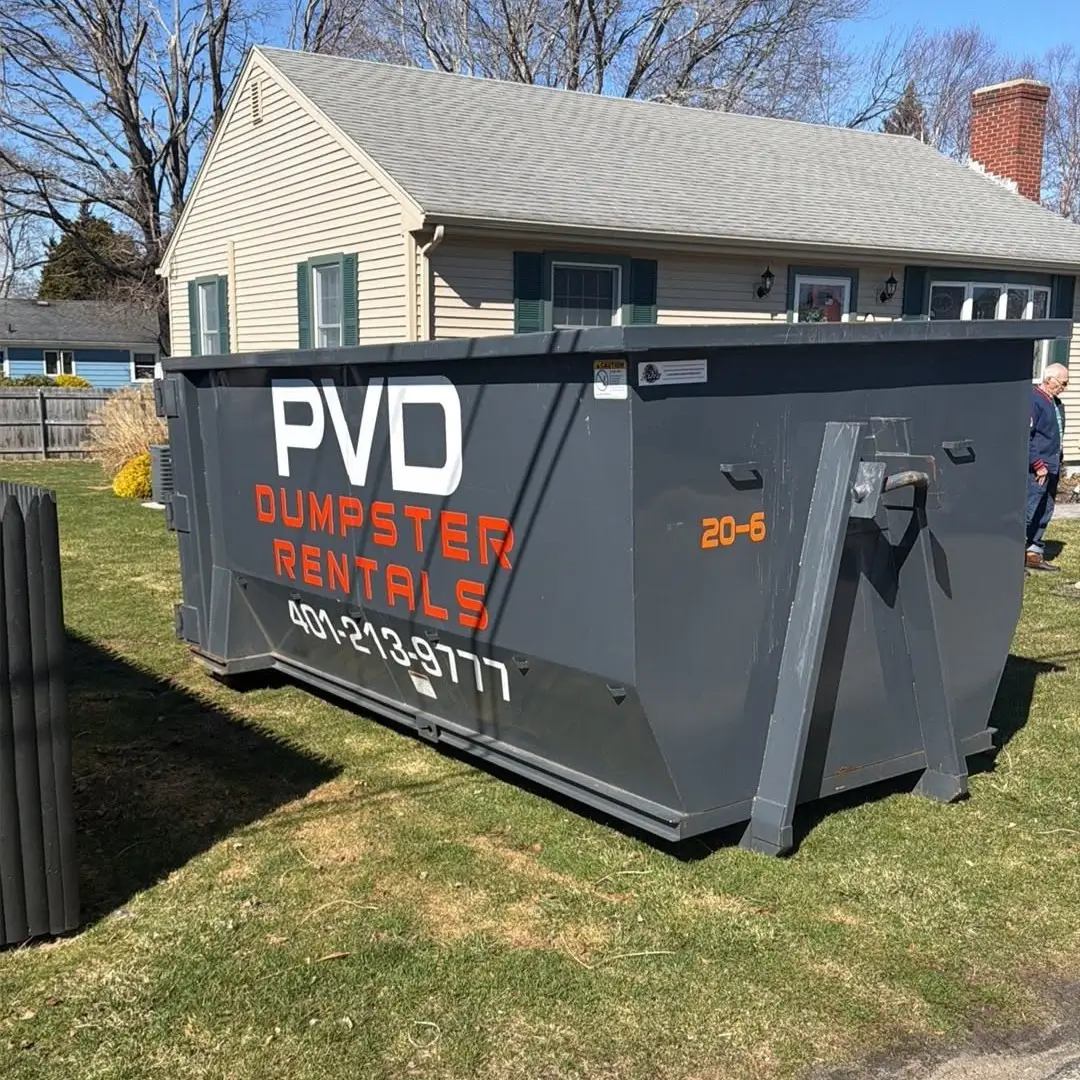 20 yard dumpster placed on a yard for a yard waste cleanup in Rhode Island