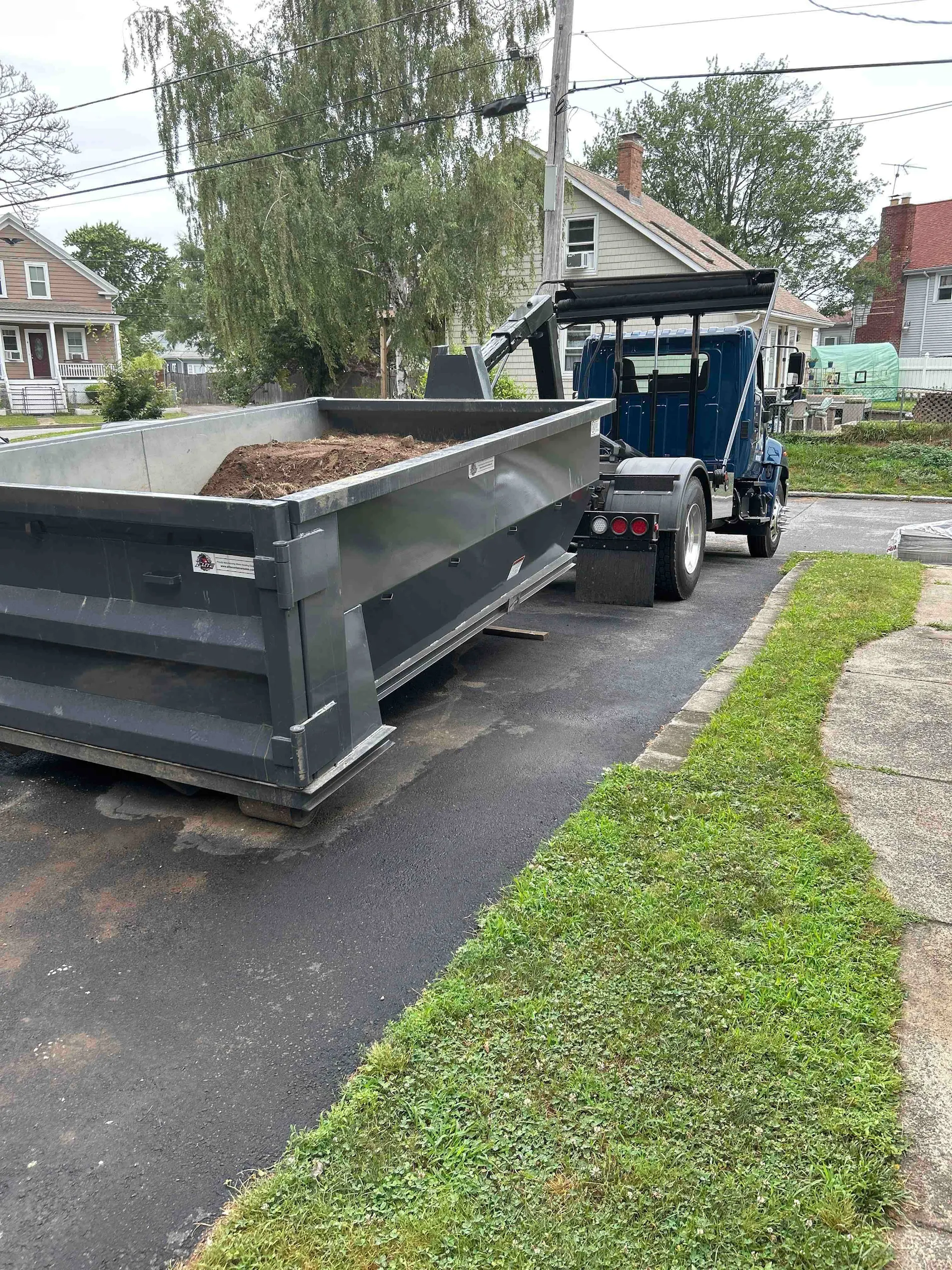Dedicated dirt dumpster loaded with soil and clean fill in Cranston